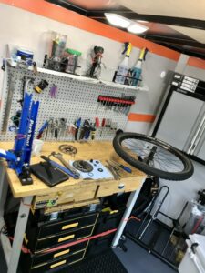 Workbench with bike wheel and parts